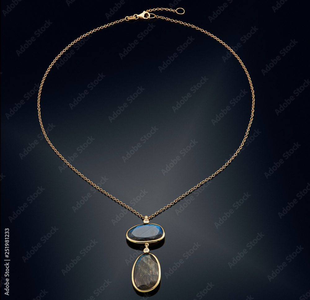 Golden necklace with isolated on black