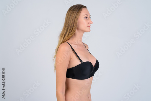 Profile view of blonde woman wearing bikini © Ranta Images