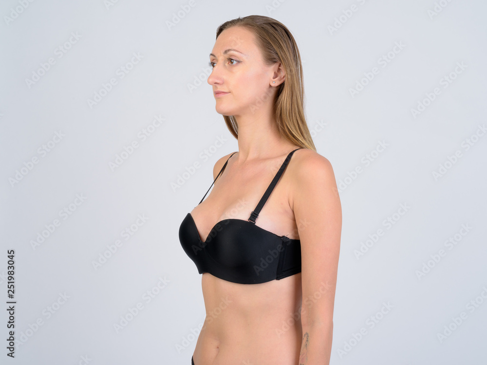 Fototapeta premium Portrait of blonde woman in bikini thinking