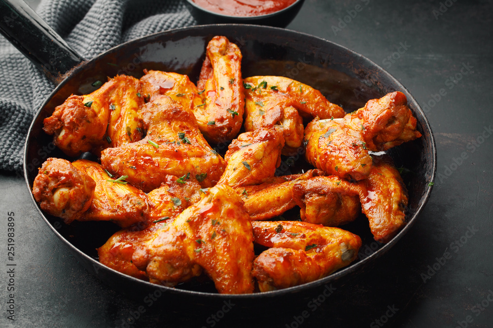 Chicken wings grilled in sauce on pan Chicken wings grilled in sauce on pan