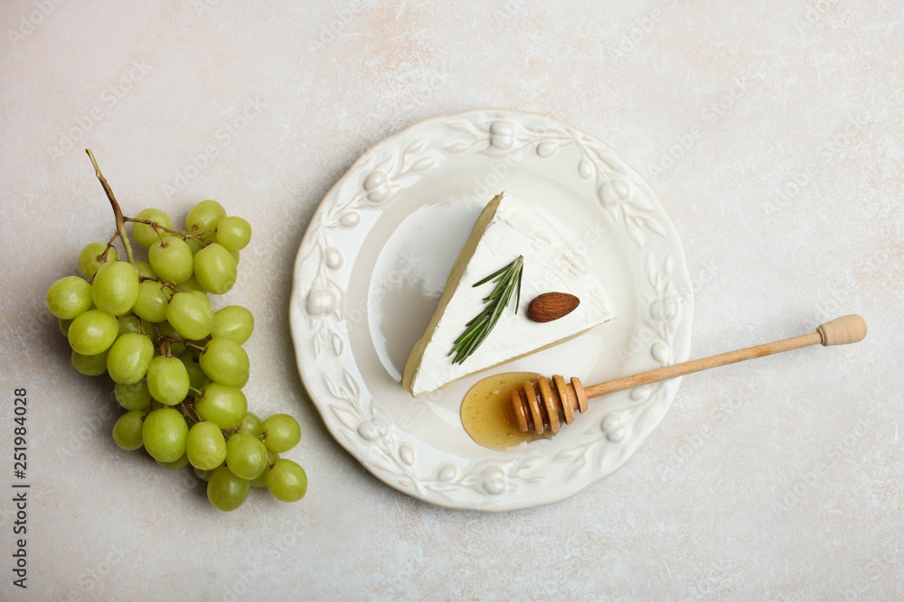 white Camembert cheese with honey and grapes white Camembert cheese with honey and grapes