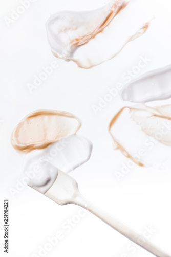Smeared creme on white background. Dermatology and skincare. Beauty conception.