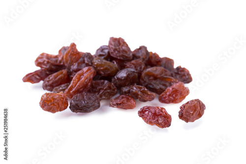 Dried grapes raisins isolated on white. Fruit background. Angle view