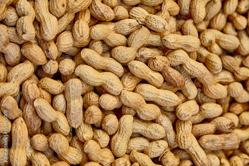 Large group pf peanuts on market for sale close up background shot