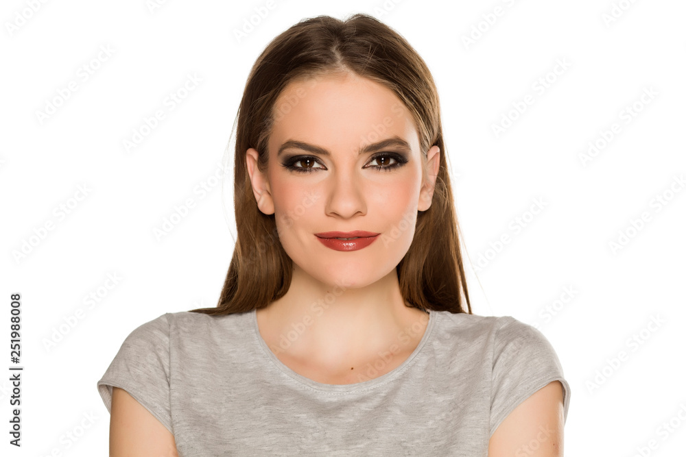 Young woman with makeup, posing on white background Young woman with makeup, posing on white background