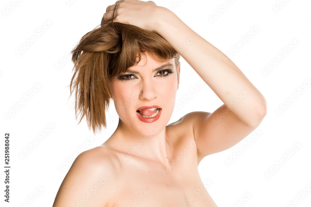 Young woman with makeup, posing on white background Young woman with makeup, posing on white background