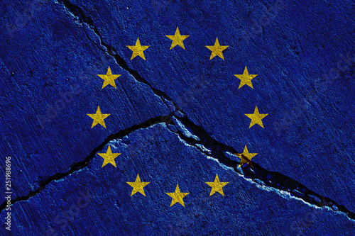 europe union flags painted over cracked concrete wall photo