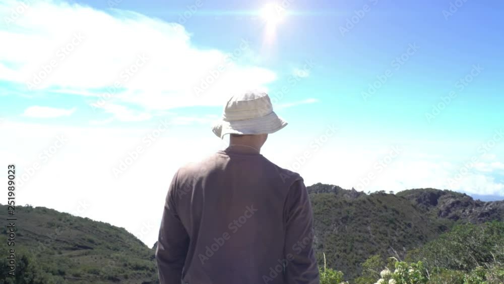 Man Reaching The Top. Jumping happy at the top of mountain. Achievement concept. Doing His Best. Euphoria Man Reaching The Top. Jumping happy at the top of mountain. Achievement concept. Doing His Best. Euphoria