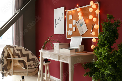 Stylish workplace with lapt...