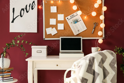 Stylish workplace with lapt...