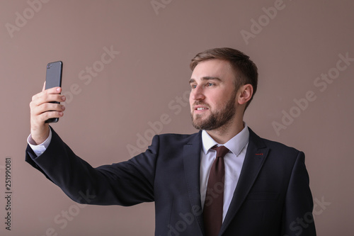 Handsome businessman taking...