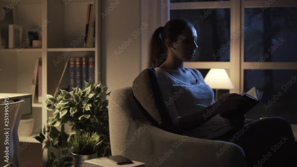 Woman reading a book at home Woman reading a book at home