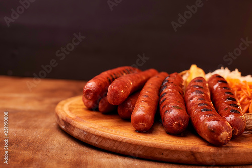sausage on wooden cutting board