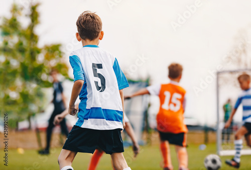 Soccer Boys Kicking Match. Young Footballers on Football Pitch. Sports Tournament Competition Between School Soccer Teams. Children in Sportswear Jersey