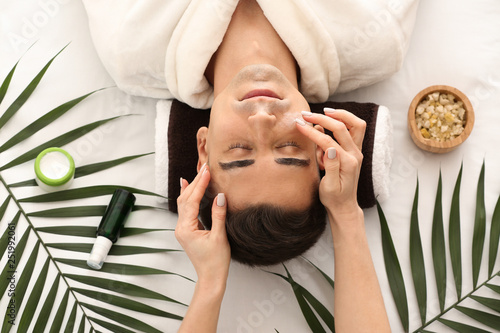 Man receiving face massage ...