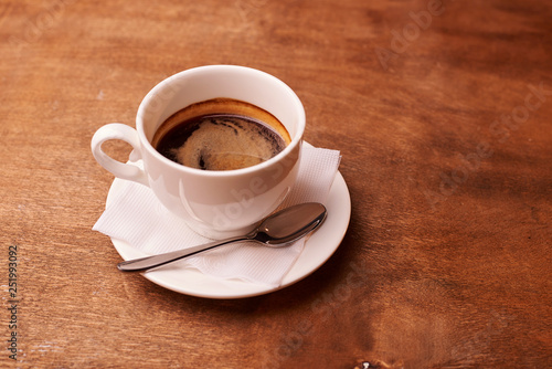 cup of coffee on wooden table