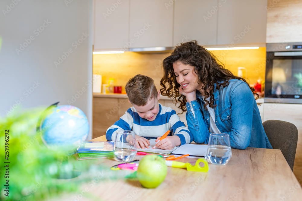 Fototapeta premium A Mother Helping Son for the Homework at home