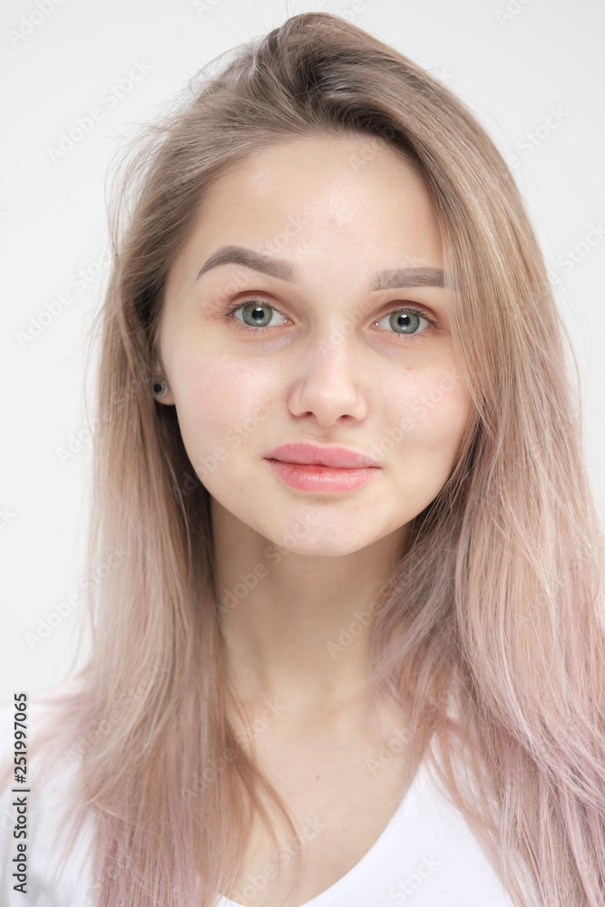 Close-up of the face of a beautiful young blonde girl with smooth skin. Close-up of the face of a beautiful young blonde girl with smooth skin.