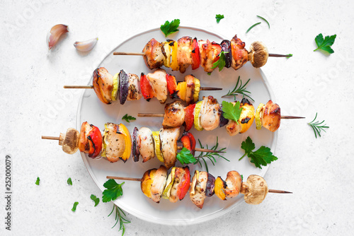 Chicken and vegetable skewers photo