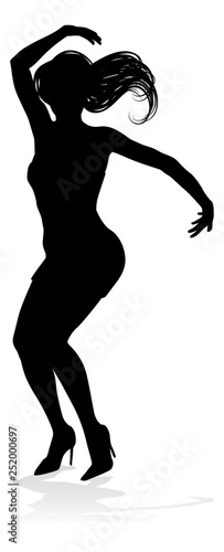 A woman dancer dancing in silhouette