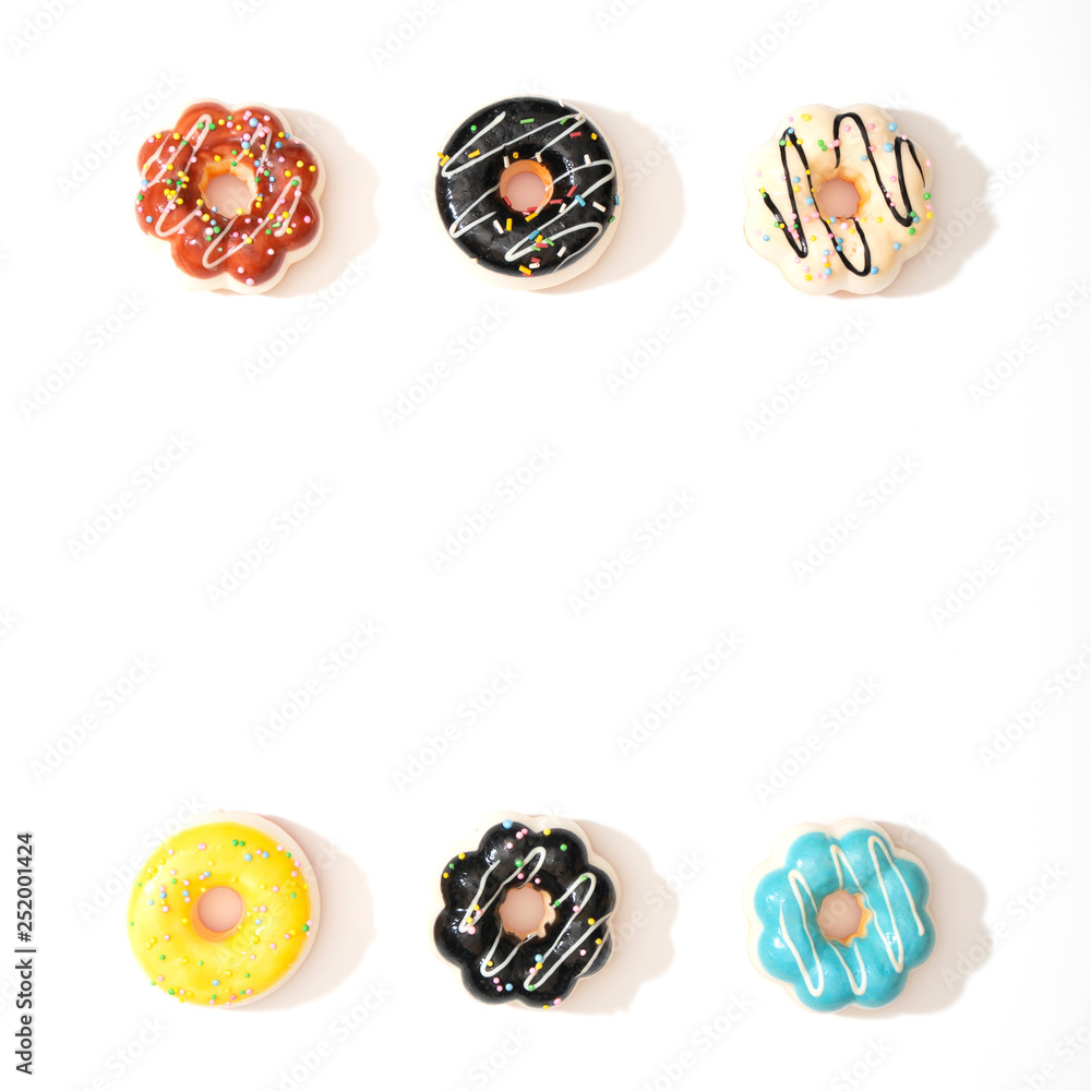 Set of colorful donuts isolated on white background. Set of colorful donuts isolated on white background.
