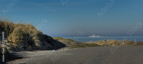 Marine Ship at Dutch coast. Den helder Netherlands. Dunes