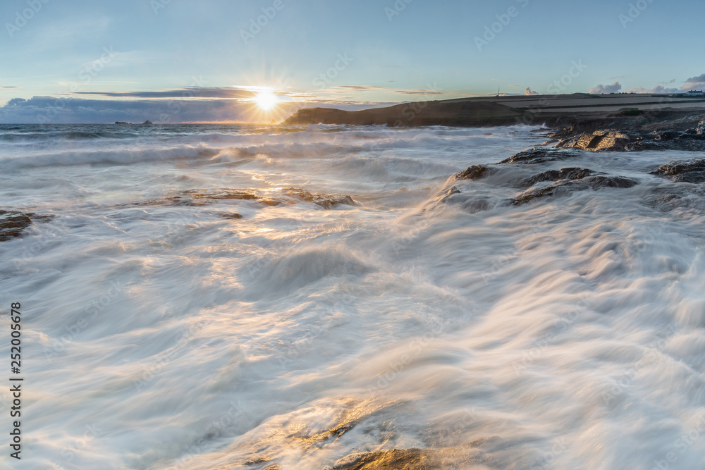 Fototapeta premium Surf at High Tide over Rocks, Constantine Bay, Cornwall, UK