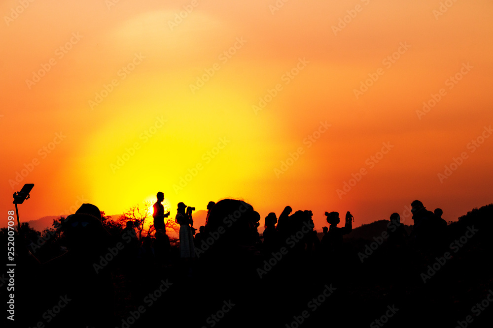 silhouettes of people taking pictures with smartphone