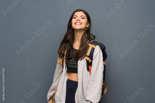 Teenager traveler girl over wall