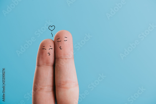 cropped view of loving couple of fingers kissing isolated on blue
