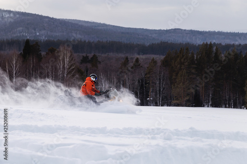 Athlete on a snowmobile.