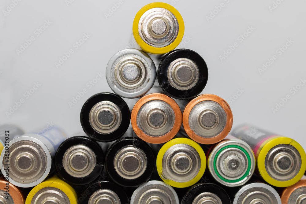 Pile of alkaline batteries. Closeup of used AA batteries ready for recycling, colorful batteries pyramid - Image Pile of alkaline batteries. Closeup of used AA batteries ready for recycling, colorful batteries pyramid - Image