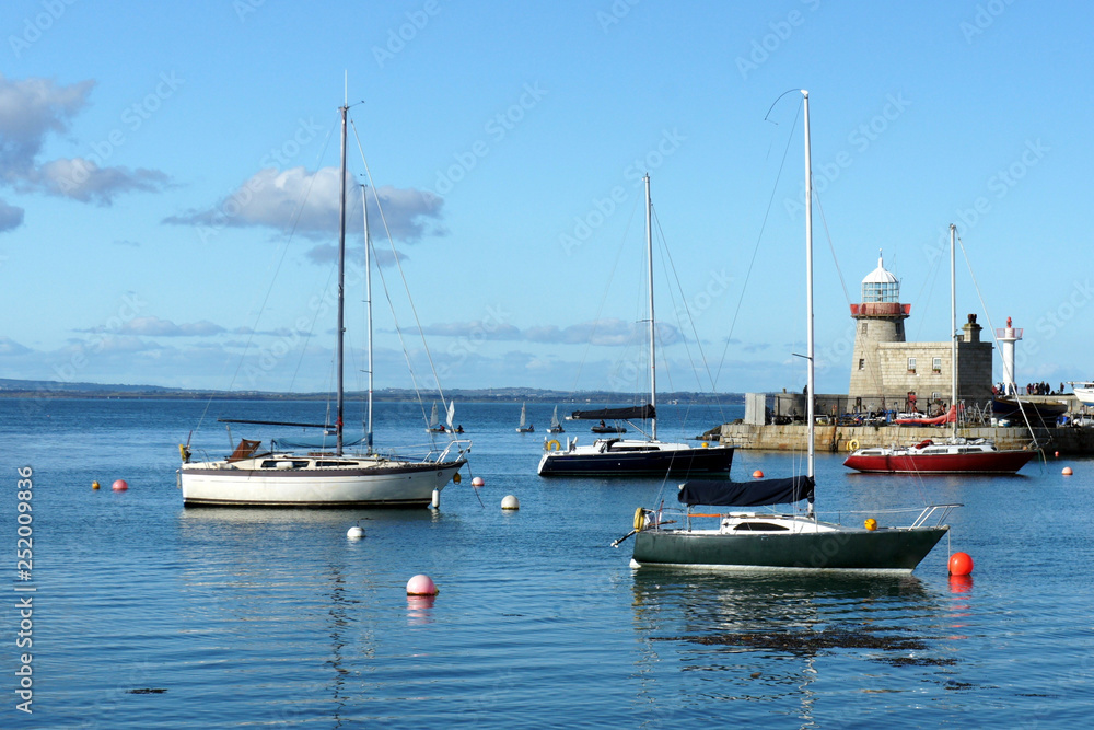 Yachts and old lighthouse. Yachts and old lighthouse.