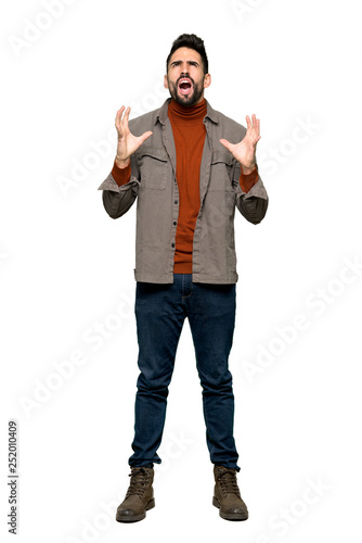 Full-length shot of Handsome man with beard frustrated by a bad situation on isolated white background