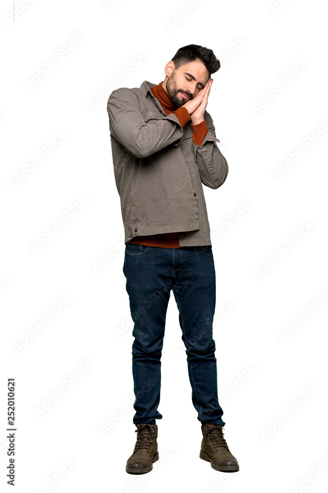 Full-length shot of Handsome man with beard making sleep gesture in dorable expression on isolated white background Full-length shot of Handsome man with beard making sleep gesture in dorable expression on isolated white background
