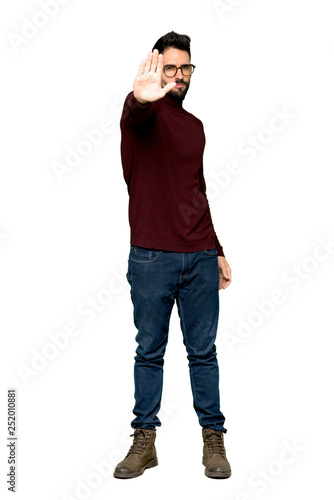 Full-length shot of Handsome man with glasses making stop gesture denying a situation that thinks wrong on isolated white background