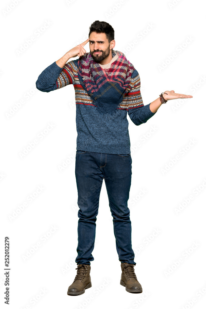 Full-length shot of Hippie man making the gesture of madness putting finger on the head on isolated white background Full-length shot of Hippie man making the gesture of madness putting finger on the head on isolated white background
