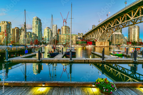 Beautiful view of Vancouver BC next to Granville Bridge along False Creek at twilight time photo