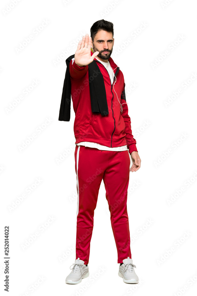 Full-length shot of Handsome sportman making stop gesture denying a situation that thinks wrong on isolated white background Full-length shot of Handsome sportman making stop gesture denying a situation that thinks wrong on isolated white background