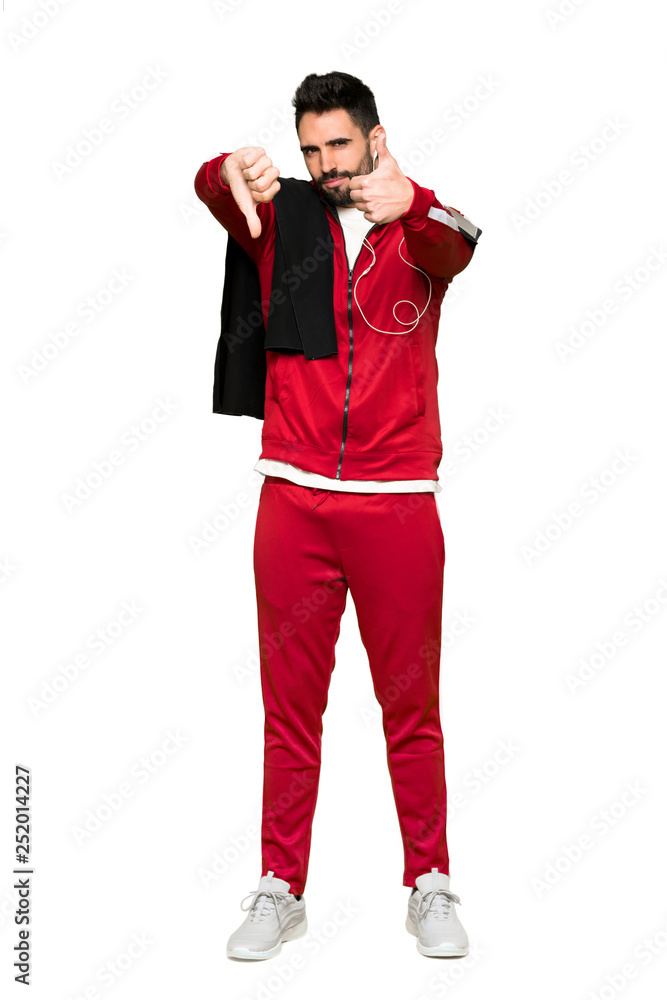 Full-length shot of Handsome sportman making good-bad sign. Undecided between yes or not on isolated white background Full-length shot of Handsome sportman making good-bad sign. Undecided between yes or not on isolated white background