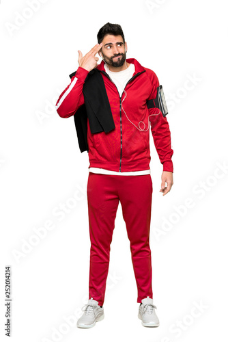 Full-length shot of Handsome sportman with problems making suicide gesture on isolated white background