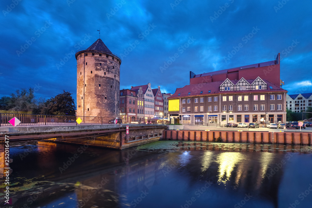 Historic Brama Stagiewna (Milk cans gate) in old town at night in Gdansk, Poland