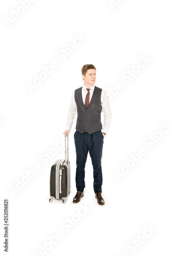 handsome stylish businessman with baggage for business trip, isolated on white