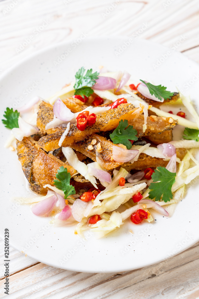 crispy gourami fish with spicy salad crispy gourami fish with spicy salad