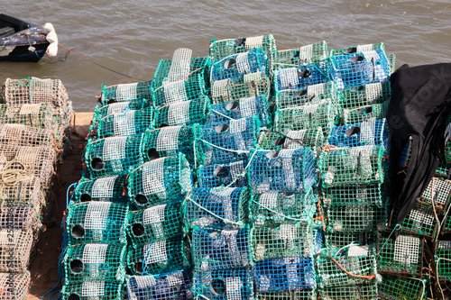 various fishing gear on the dock, near the ocean