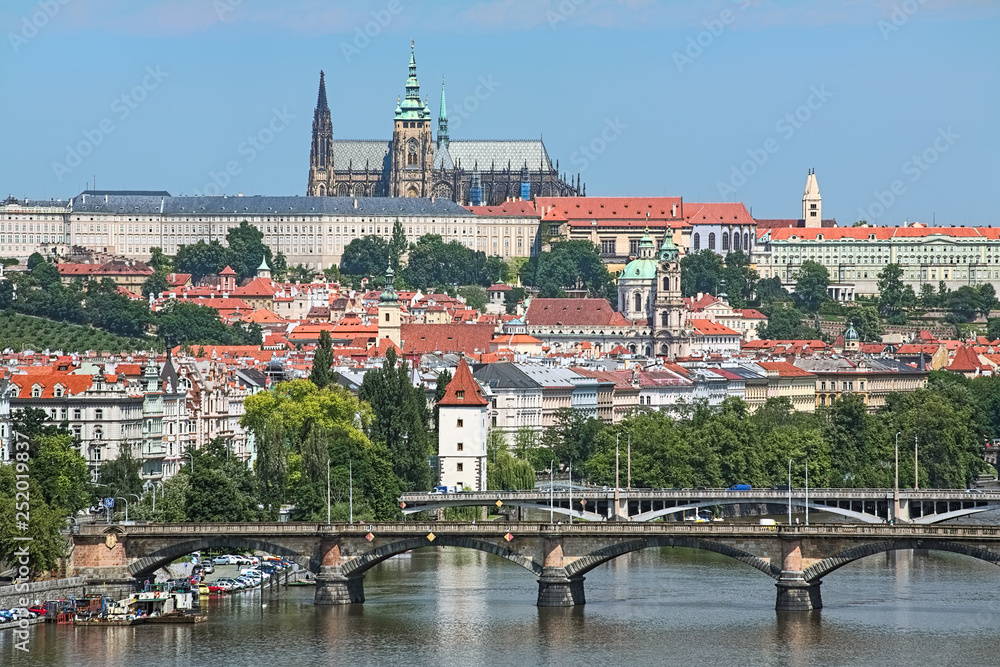 Prague, Czech Republic. Prague Castle with St. Vitus Cathedral, Mala Strana district and bridges across Vltava river. View from Vysehrad Hill.