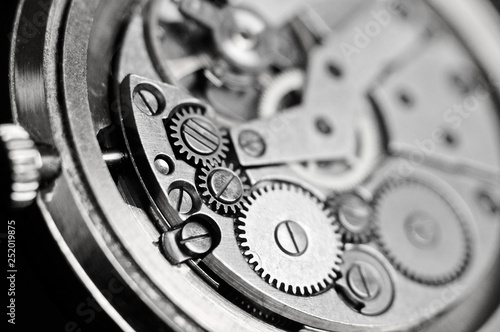 Mechanism of wrist watches in the clear. Shallow depth of field