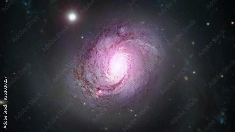 Spiral galaxy rotating in outer space pink on star field. Contains public domain image by Nasa Spiral galaxy rotating in outer space pink on star field. Contains public domain image by Nasa