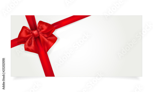 Paper gift voucher with red bow photo