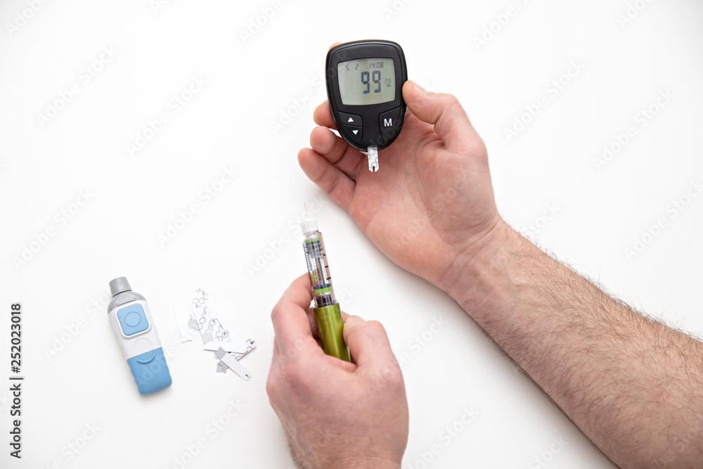 Diabetic is doing a glucose level finger blood test Diabetic is doing a glucose level finger blood test